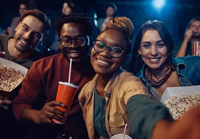 group of young adults at a move theater
